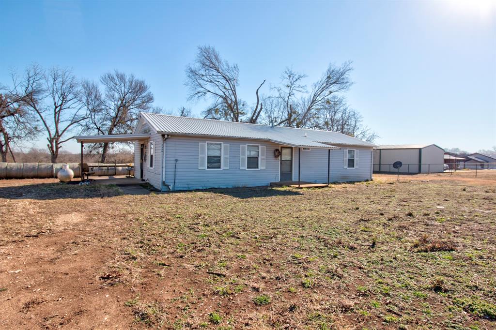 3356 Old Dorchester Road Sherman, TX 75092 - Photo 16 of 22 a house with a yard covered with snow in front of it