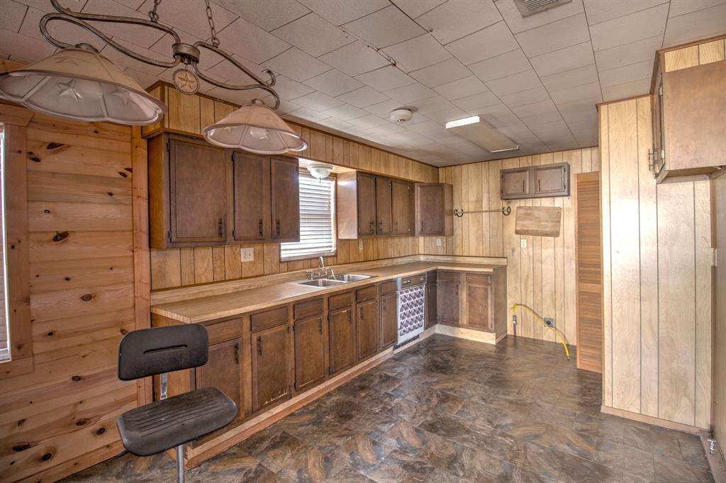 3356 Old Dorchester Road Sherman, TX 75092 - Photo 21 of 22 a large kitchen with a large window cabinets and stainless steel appliances