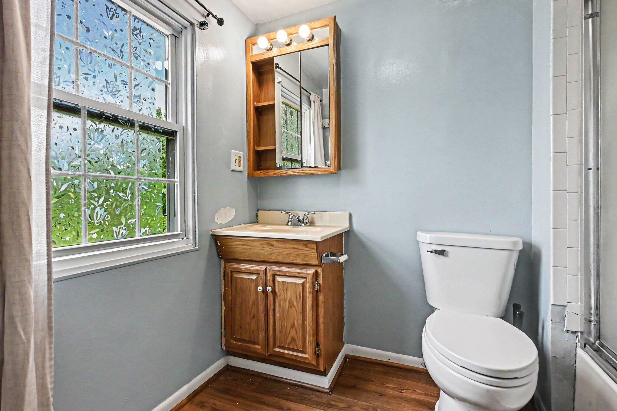 115 McClung Road La Porte, IN 46350 - Photo 15 of 31 a bathroom with a toilet a sink and a mirror