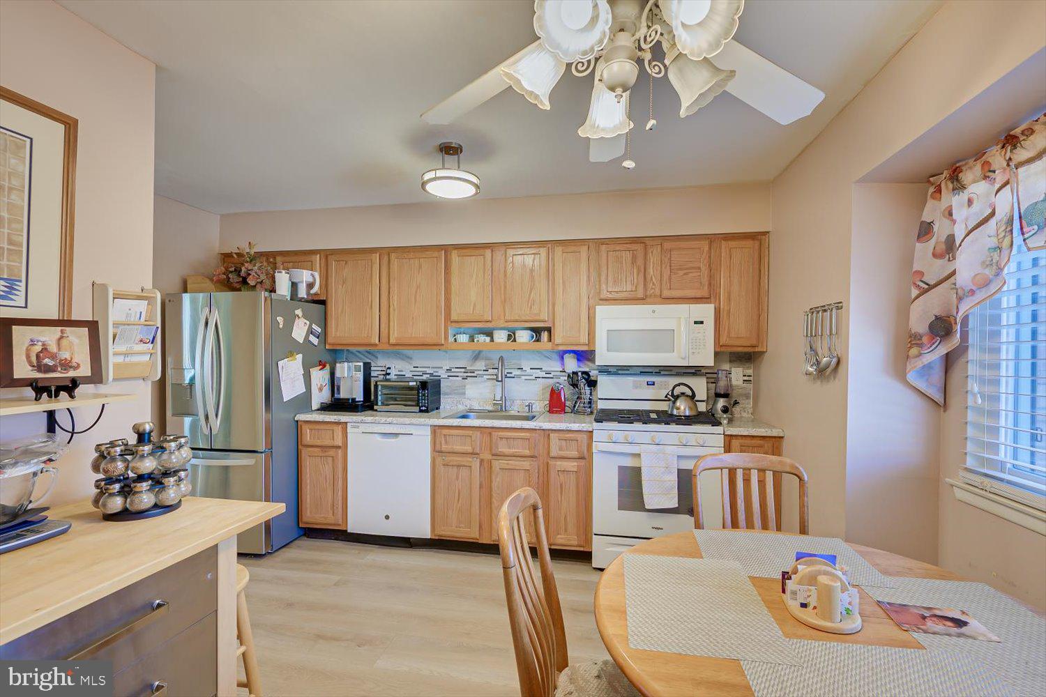 806 Robin Road Hillsborough, NJ 08844 - Photo 12 of 37 a kitchen with stainless steel appliances granite countertop a sink stove and refrigerator