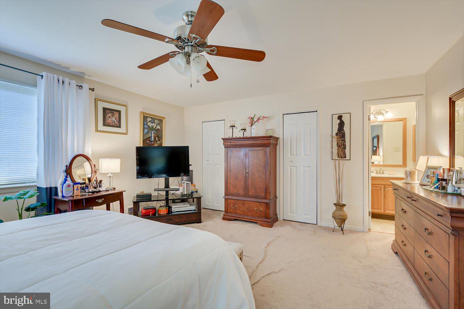 806 Robin Road Hillsborough, NJ 08844 - Photo 19 of 37 a bedroom with a bed and a flat screen tv