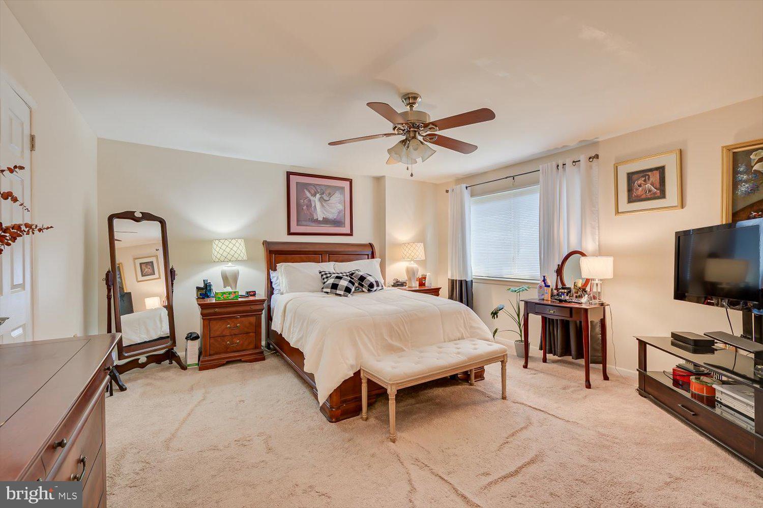 806 Robin Road Hillsborough, NJ 08844 - Photo 20 of 37 a spacious bedroom with a bed and a flat screen tv