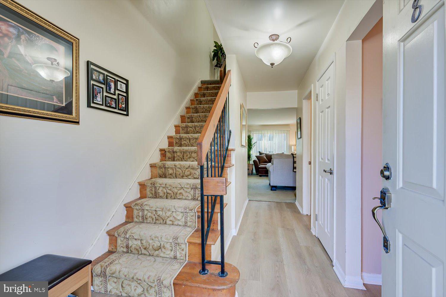 806 Robin Road Hillsborough, NJ 08844 - Photo 4 of 37 a view of a hallway with furniture and stairs