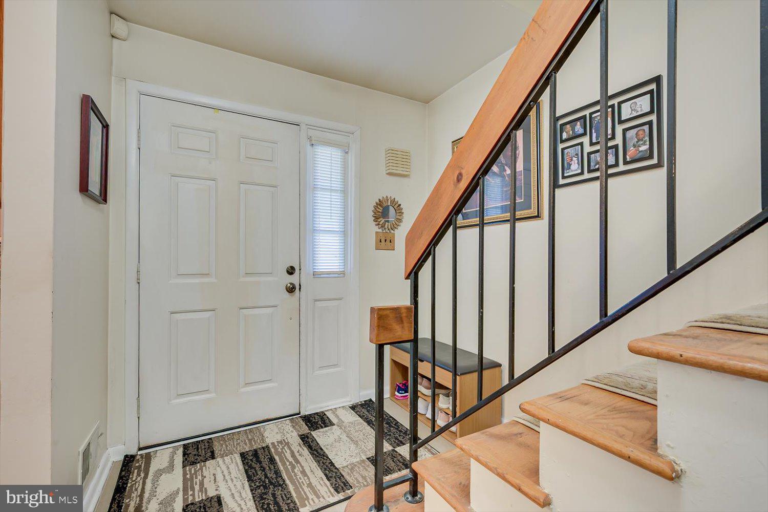 806 Robin Road Hillsborough, NJ 08844 - Photo 5 of 37 a view of front door with wooden floor and stairs