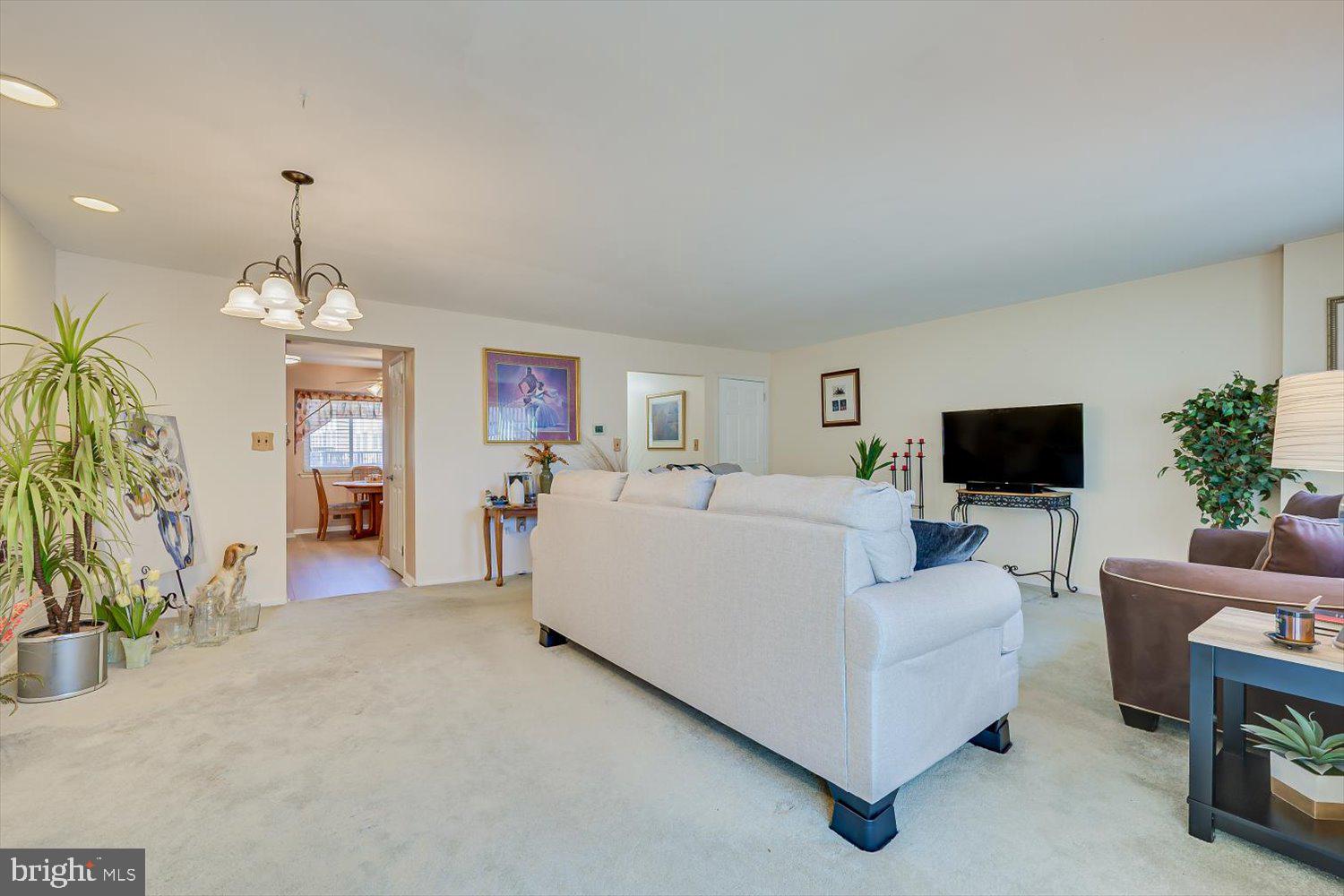806 Robin Road Hillsborough, NJ 08844 - Photo 7 of 37 a living room with furniture and a flat screen tv