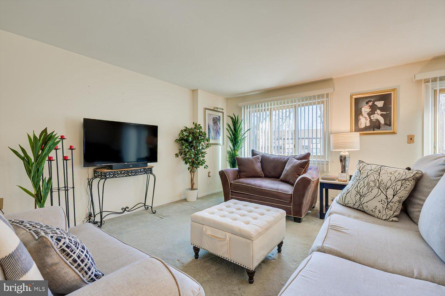 806 Robin Road Hillsborough, NJ 08844 - Photo 9 of 37 a living room with furniture and a flat screen tv