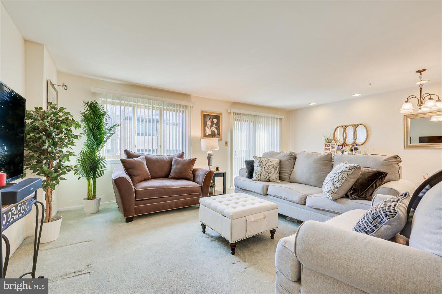 806 Robin Road Hillsborough, NJ 08844 - Photo 10 of 37 a living room with furniture a window and a flat screen tv