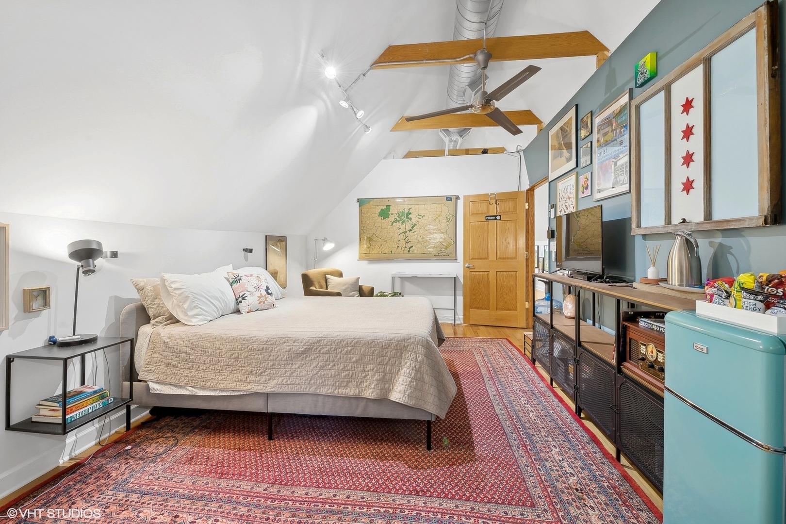 3522 West Armitage Avenue Chicago, IL 60647 - Photo 6 of 18 a bedroom with a bed and a flat tv screen on the dresser