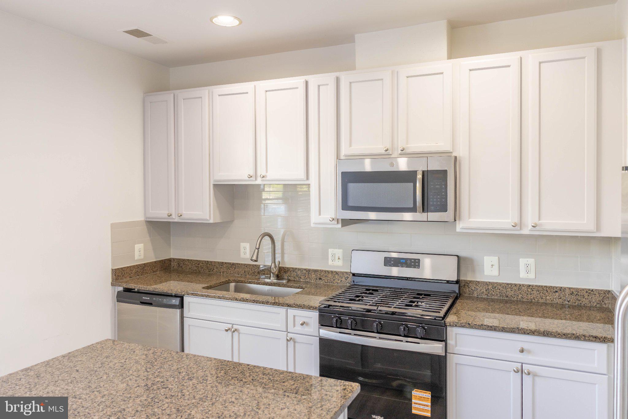 12824 Clarksburg Square Road, Unit 105 Clarksburg, MD 20871 - Photo 34 of 96 Modern kitchen with sleek finishes.