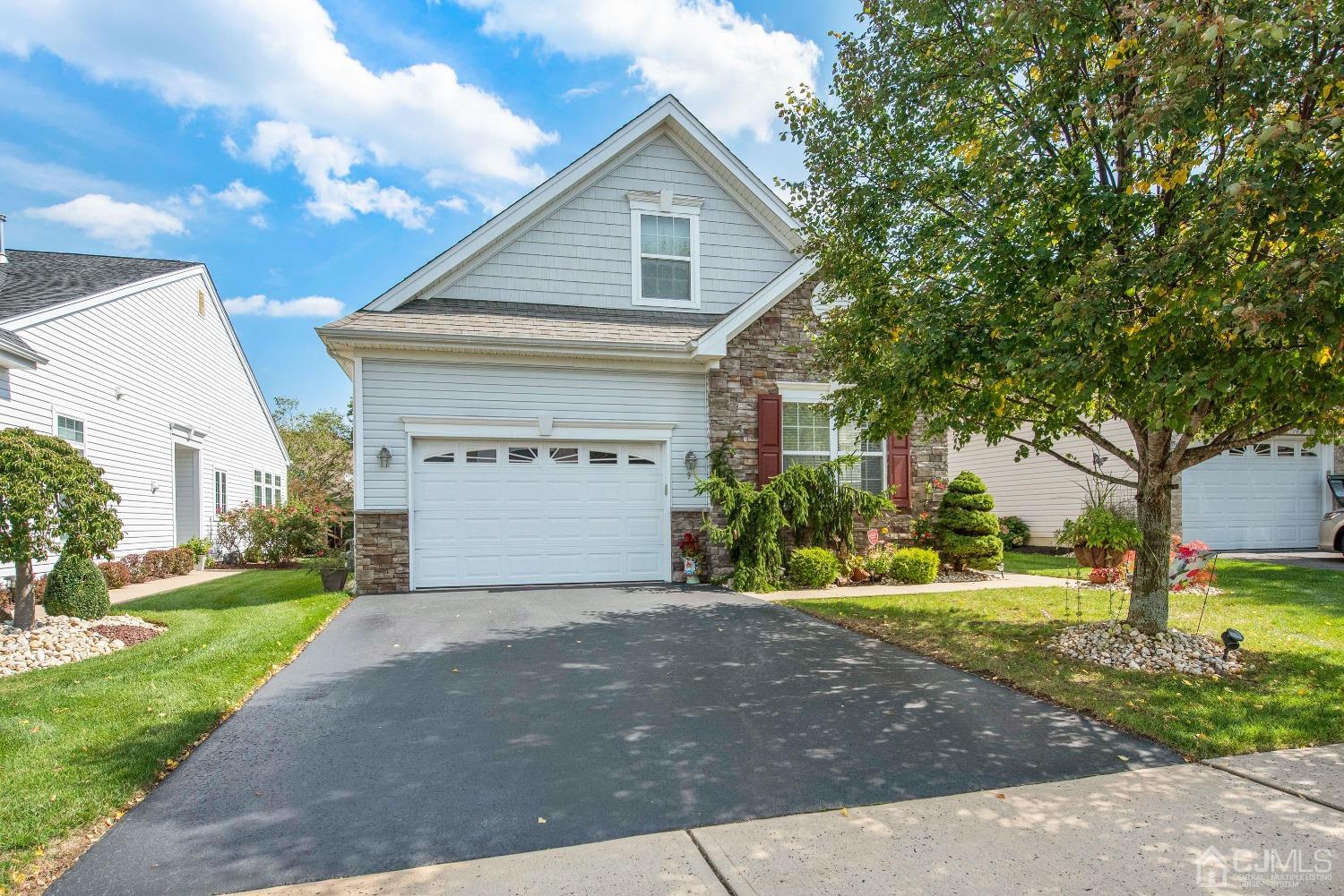 9 Turret Drive Monroe, NJ 08831 - Photo 1 of 18 a front view of a house with a yard and garage