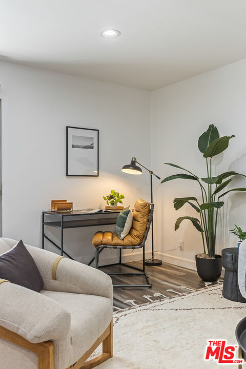 11701 Texas Avenue, Unit 306 Los Angeles, CA 90025 - Photo 12 of 42 a living room with furniture and a potted plant