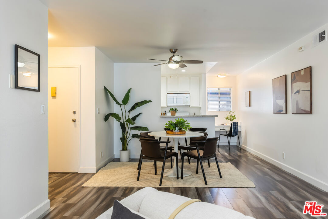 11701 Texas Avenue, Unit 306 Los Angeles, CA 90025 - Photo 16 of 42 a view of a dining room with furniture and wooden floor