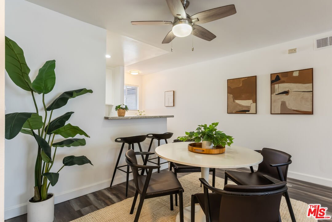 11701 Texas Avenue, Unit 306 Los Angeles, CA 90025 - Photo 17 of 42 a dining room with furniture and wooden floor