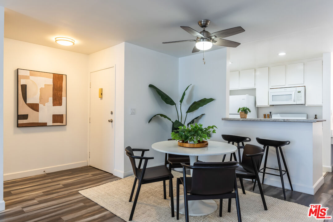 11701 Texas Avenue, Unit 306 Los Angeles, CA 90025 - Photo 2 of 42 a view of a dining room with furniture and a potted plant