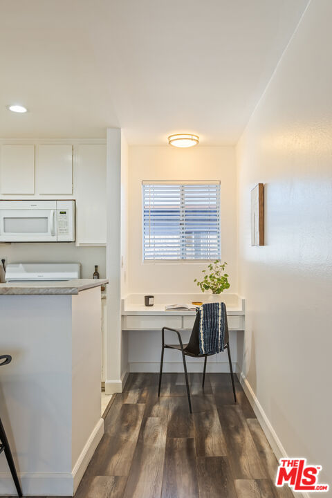 11701 Texas Avenue, Unit 306 Los Angeles, CA 90025 - Photo 21 of 42 a workspace with furniture and window