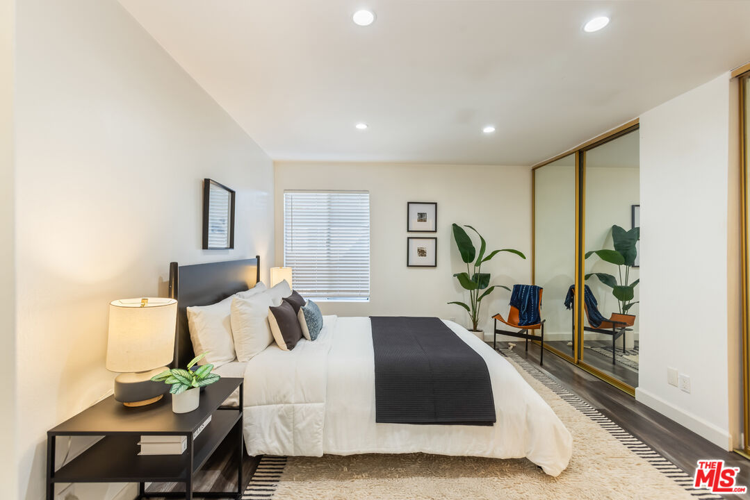 11701 Texas Avenue, Unit 306 Los Angeles, CA 90025 - Photo 26 of 42 a bedroom with furniture and a potted plant