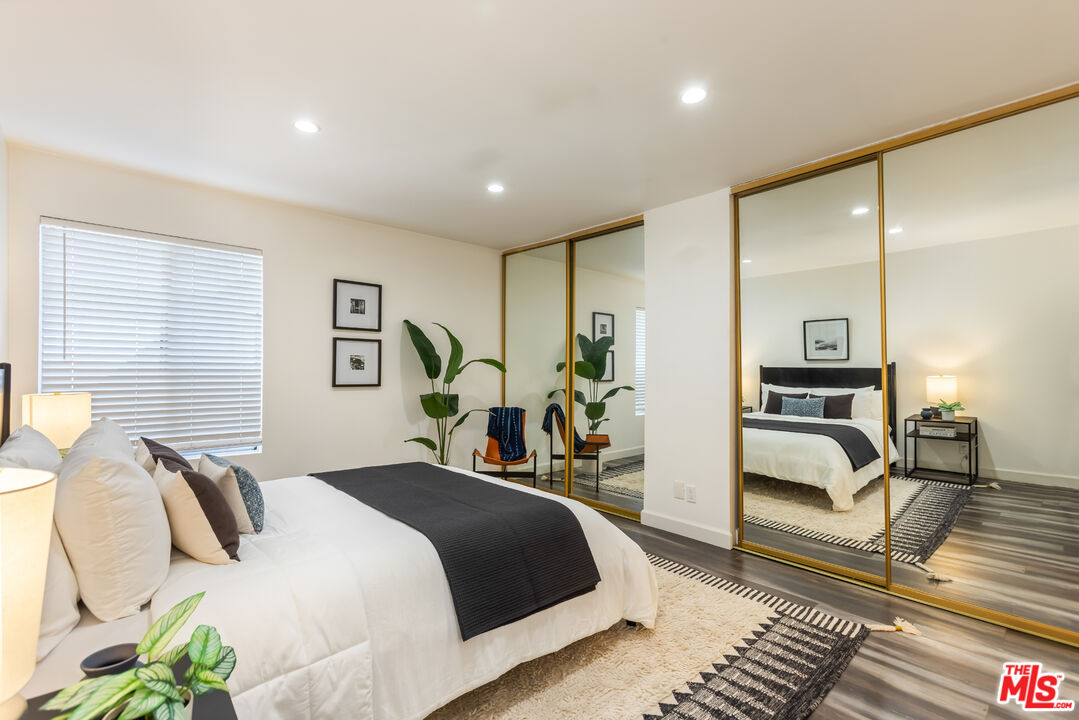 11701 Texas Avenue, Unit 306 Los Angeles, CA 90025 - Photo 27 of 42 a bedroom with a bed and a table