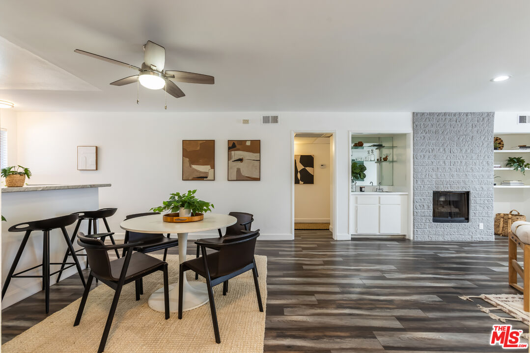 11701 Texas Avenue, Unit 306 Los Angeles, CA 90025 - Photo 3 of 42 a view of a dining room with furniture and wooden floor