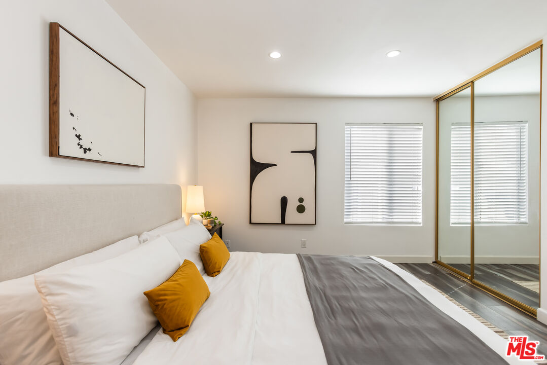 11701 Texas Avenue, Unit 306 Los Angeles, CA 90025 - Photo 36 of 42 a bedroom with a bed and a large window