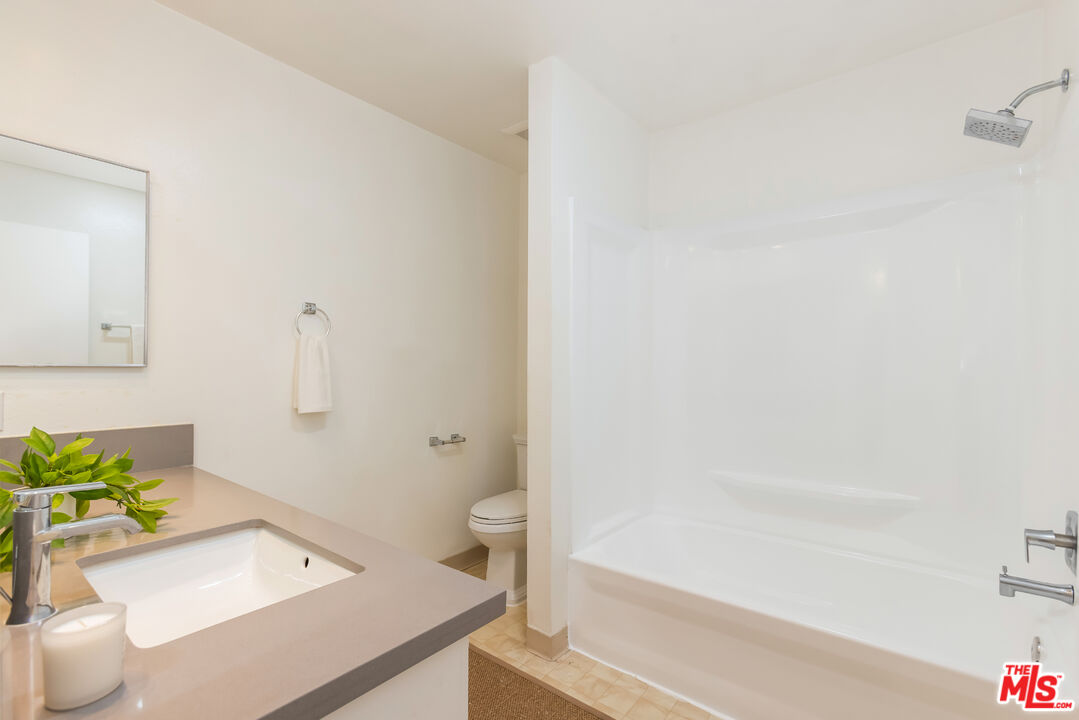 11701 Texas Avenue, Unit 306 Los Angeles, CA 90025 - Photo 37 of 42 a bathroom with a sink a toilet and tub