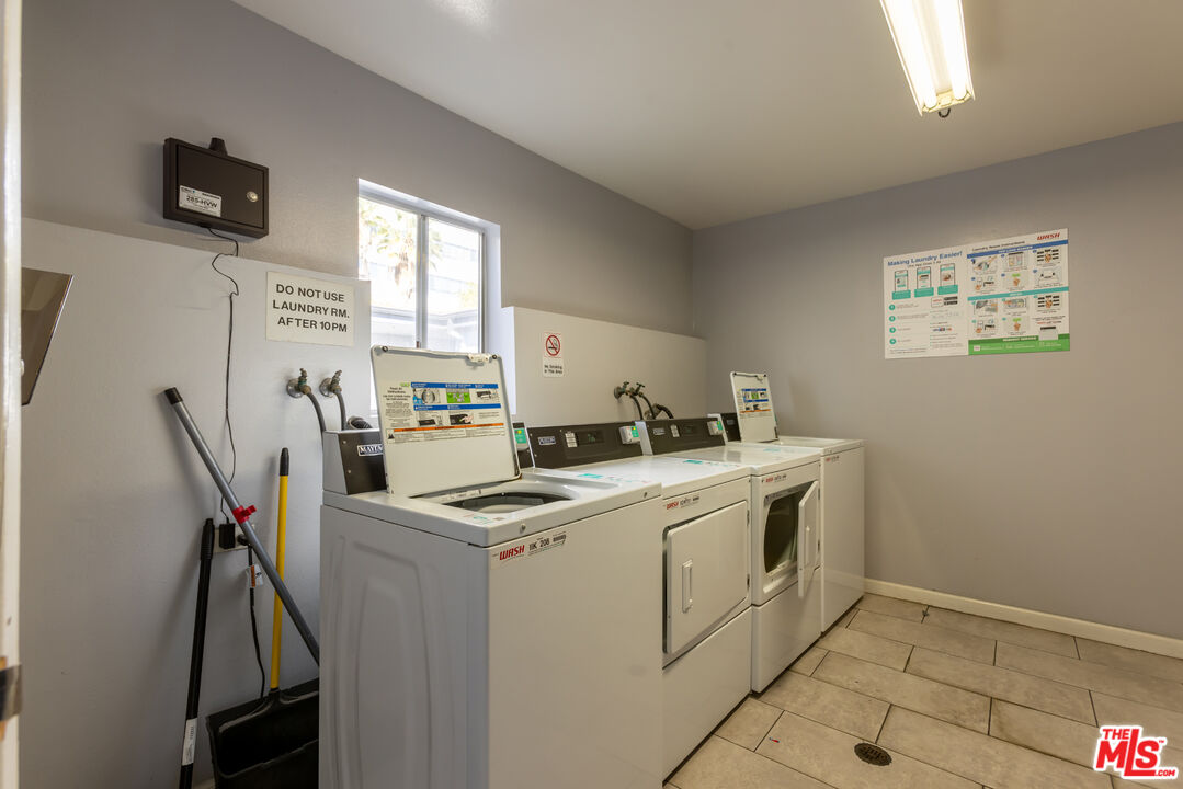 11701 Texas Avenue, Unit 306 Los Angeles, CA 90025 - Photo 39 of 42 a view of a kitchen with fridge and workspace