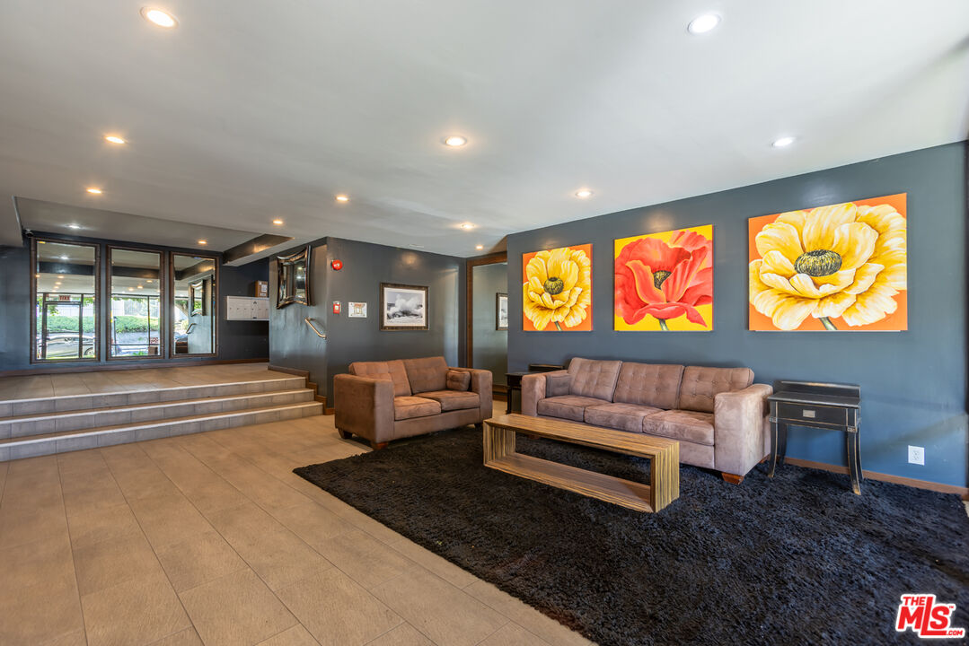 11701 Texas Avenue, Unit 306 Los Angeles, CA 90025 - Photo 41 of 42 a living room with furniture and a large window