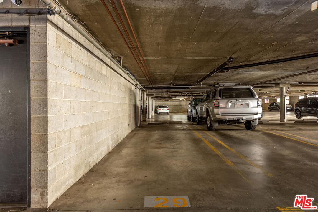 11701 Texas Avenue, Unit 306 Los Angeles, CA 90025 - Photo 42 of 42 a view of parking garage with cars parked