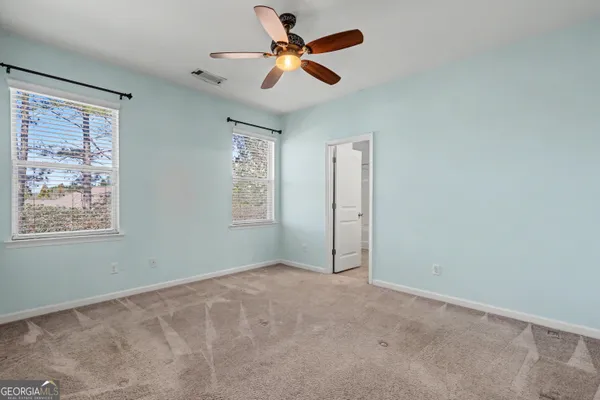 a view of room with ceiling fan