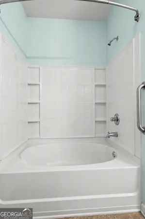 a bathroom with a sink mirror and vanity