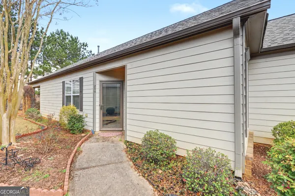 a front view of a house with garden