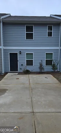 a front view of a house with yard