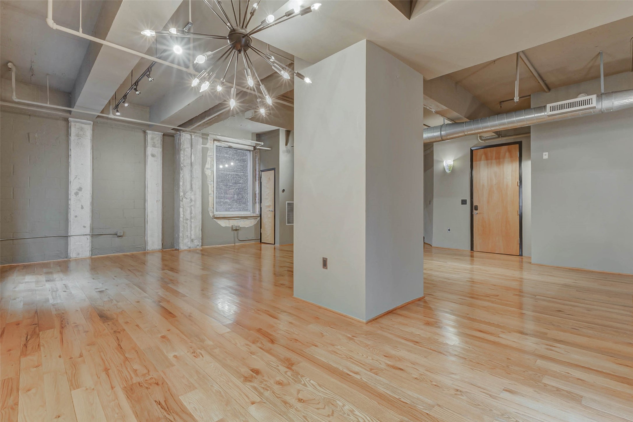 711 Main Street, Unit 505 Houston, TX 77002 - Photo 14 of 47 a view of an empty room with wooden floor
