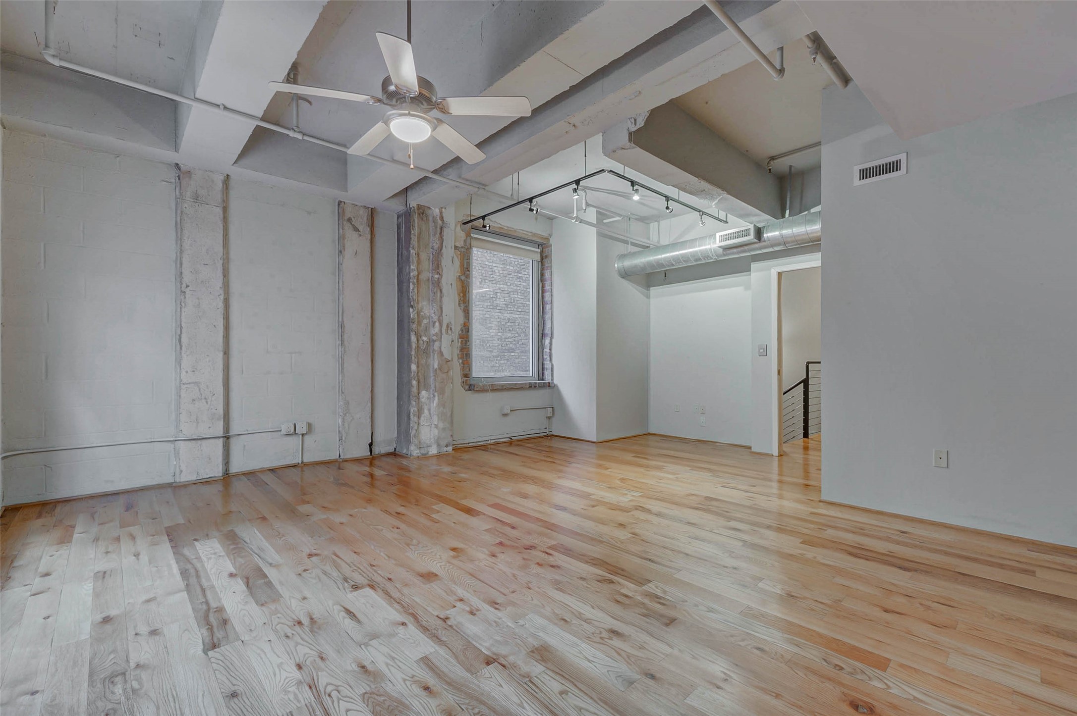 711 Main Street, Unit 505 Houston, TX 77002 - Photo 29 of 47 a view of an empty room with wooden floor