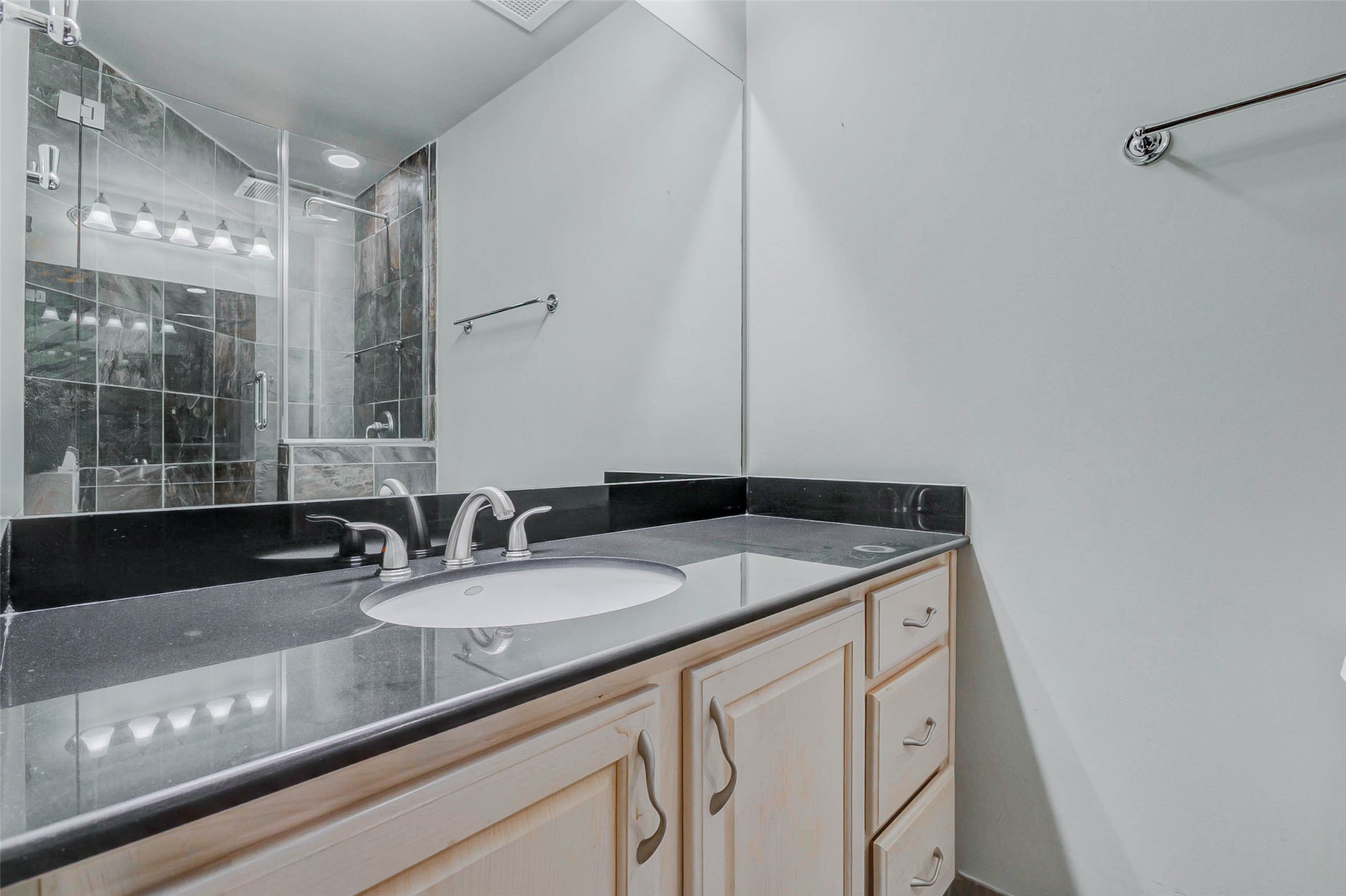 711 Main Street, Unit 505 Houston, TX 77002 - Photo 42 of 47 a bathroom with a sink and a mirror