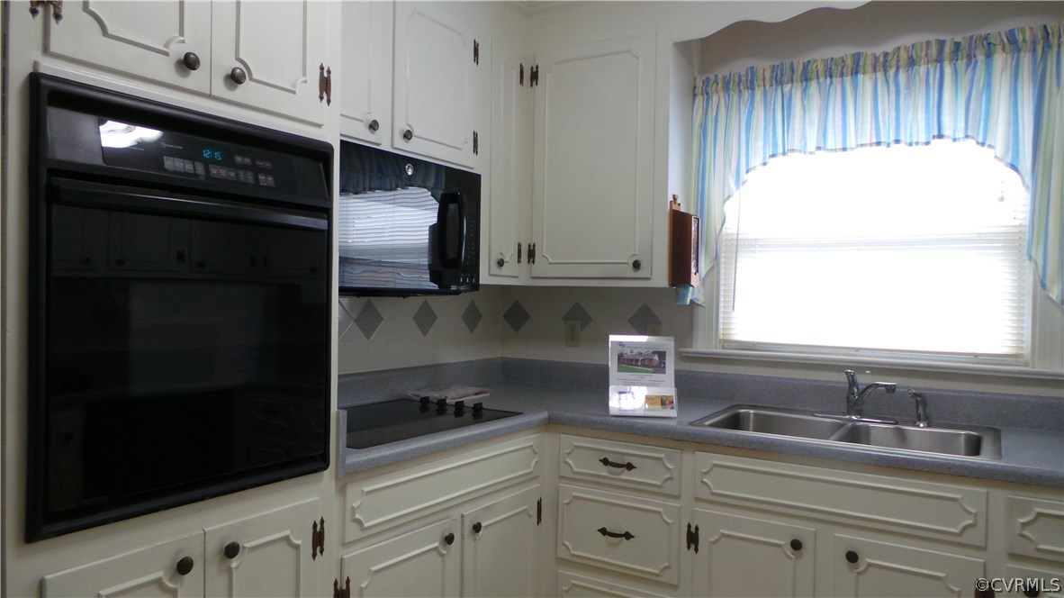 4888 Burnham Road North Chesterfield, VA 23234 - Photo 6 of 17 a kitchen with a sink and cabinets