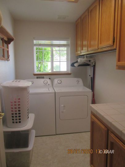 405 Vista Street Ridgecrest, CA 93555 - Photo 9 of 16 a utility room with dryer and washer