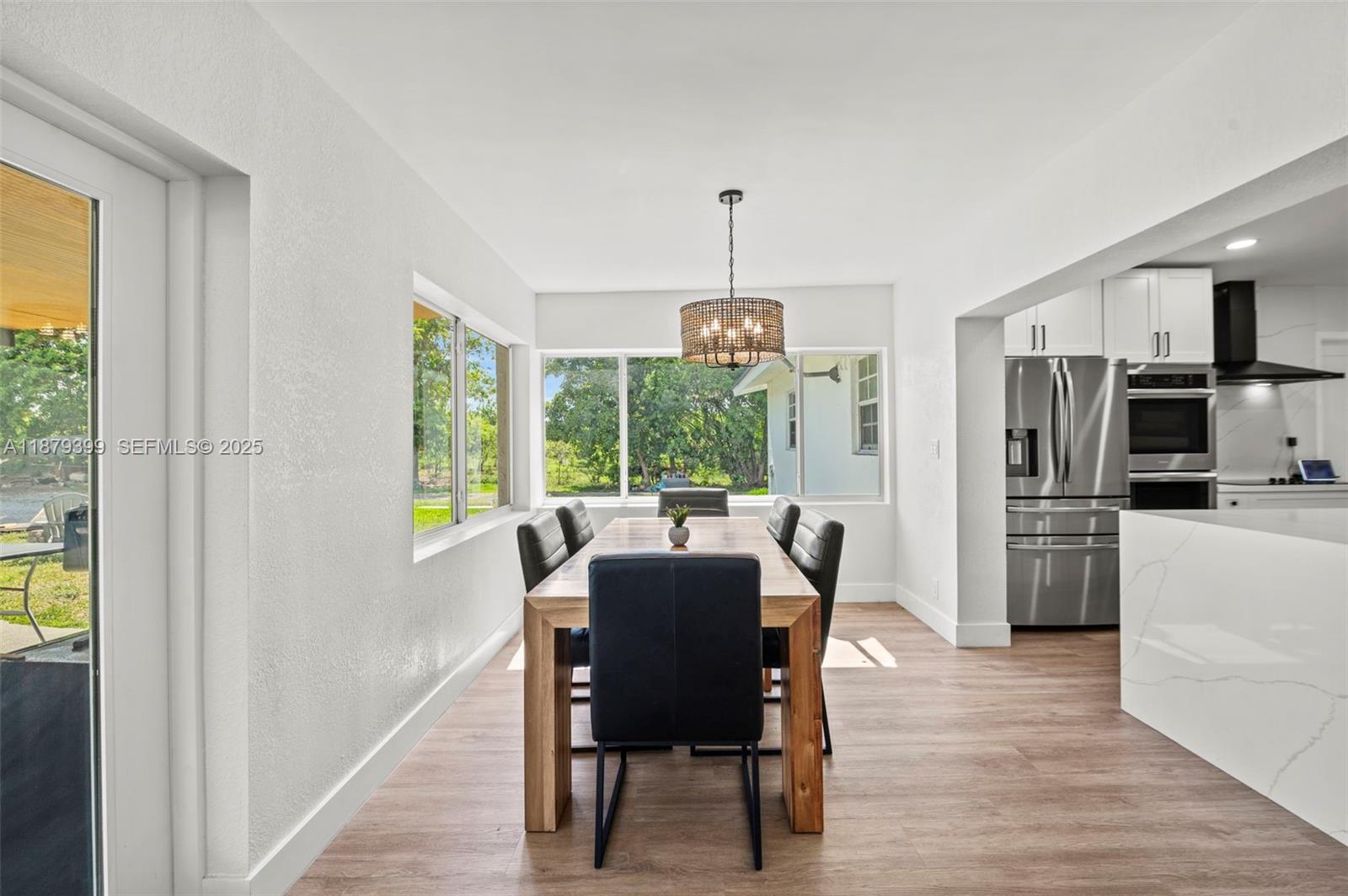 17611 Southwest 66th Street Southwest Ranches, FL 33331 - Photo 11 of 45 a view of a dining room with furniture window and outside view