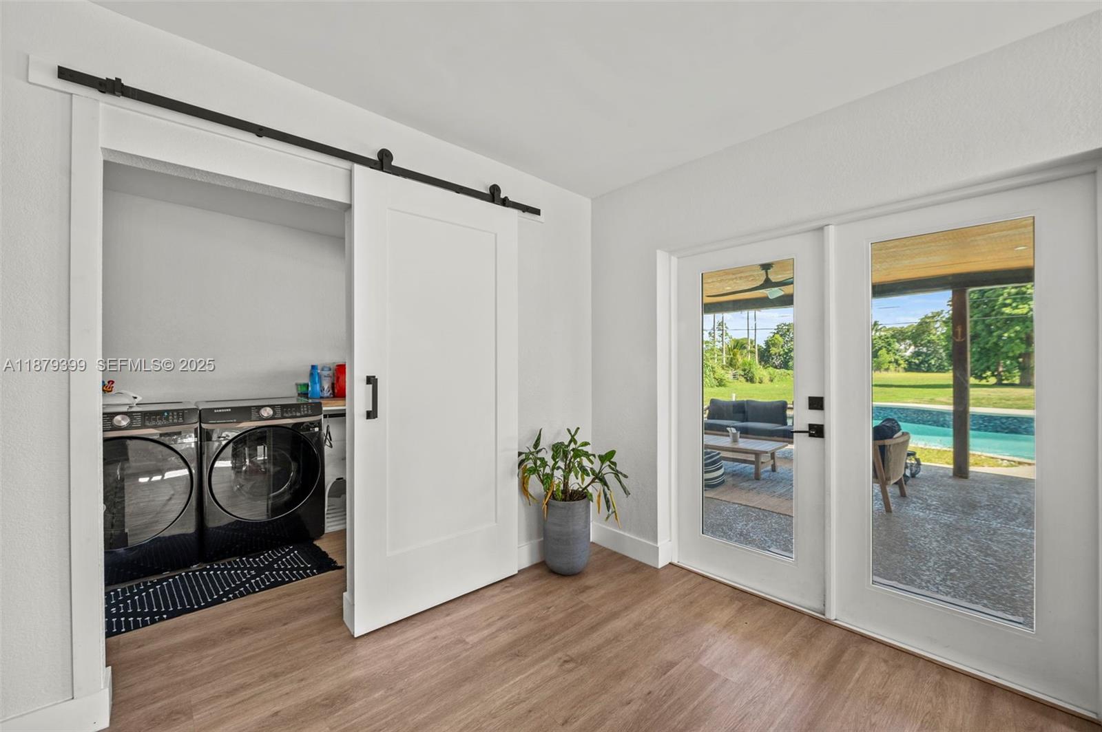 17611 Southwest 66th Street Southwest Ranches, FL 33331 - Photo 13 of 45 a view of an entryway with wooden floor