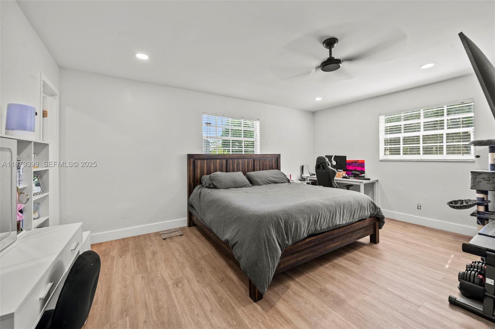 17611 Southwest 66th Street Southwest Ranches, FL 33331 - Photo 15 of 45 a spacious bedroom with a bed and a dresser in it