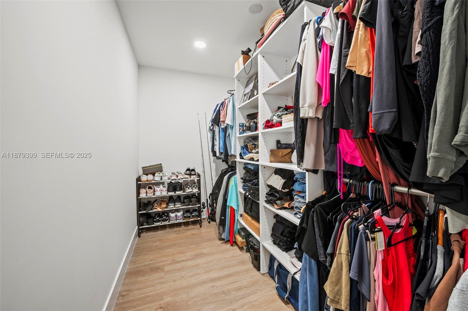 17611 Southwest 66th Street Southwest Ranches, FL 33331 - Photo 17 of 45 a view of walk in closet with clothes and shoes