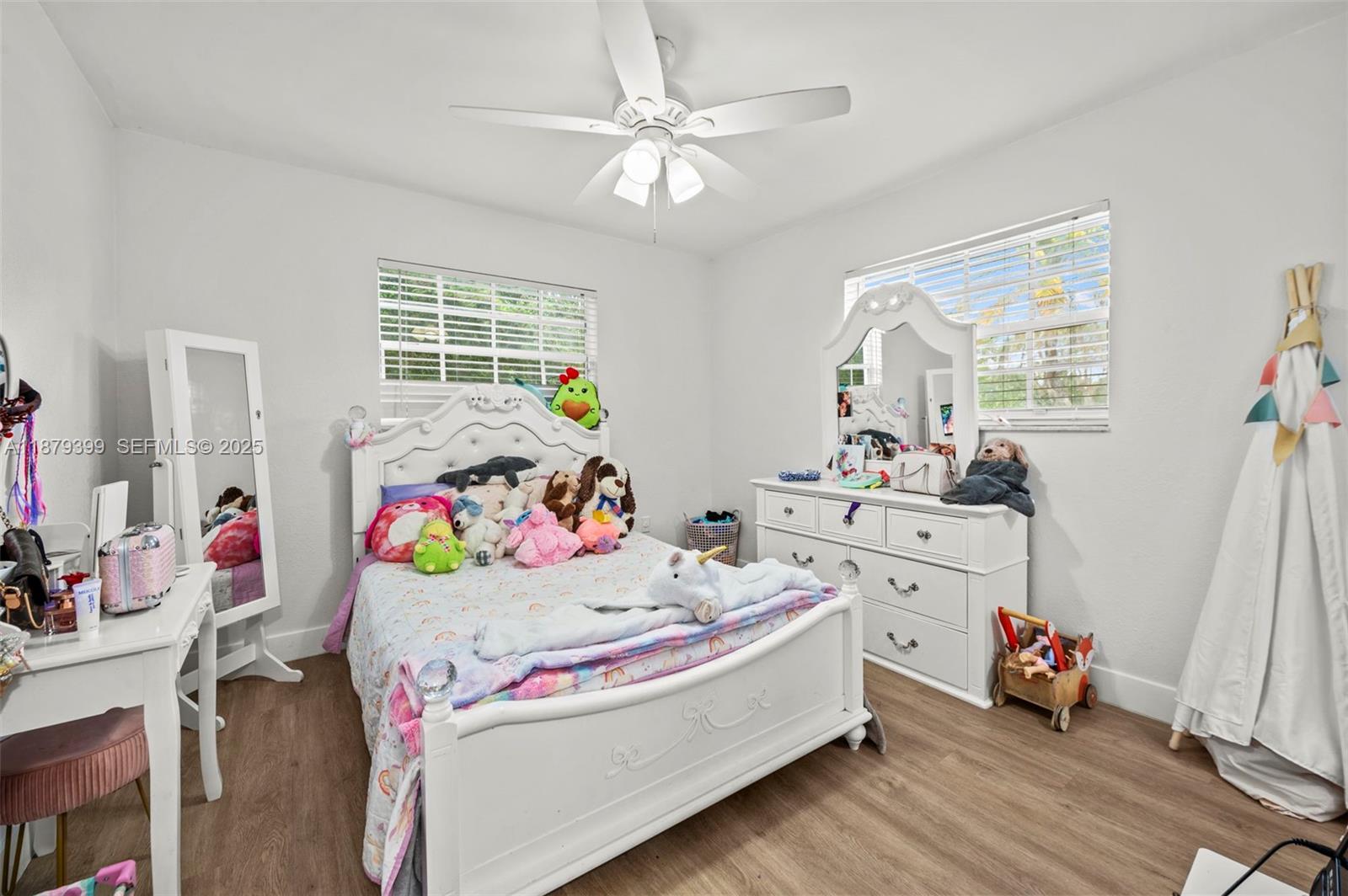 17611 Southwest 66th Street Southwest Ranches, FL 33331 - Photo 20 of 45 a bed room with furniture and a wooden floor