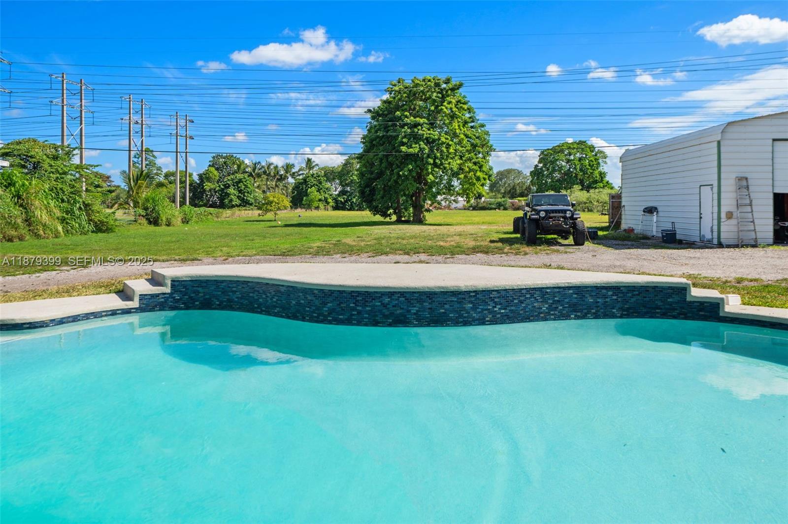 17611 Southwest 66th Street Southwest Ranches, FL 33331 - Photo 25 of 45 a view of a house with a big yard