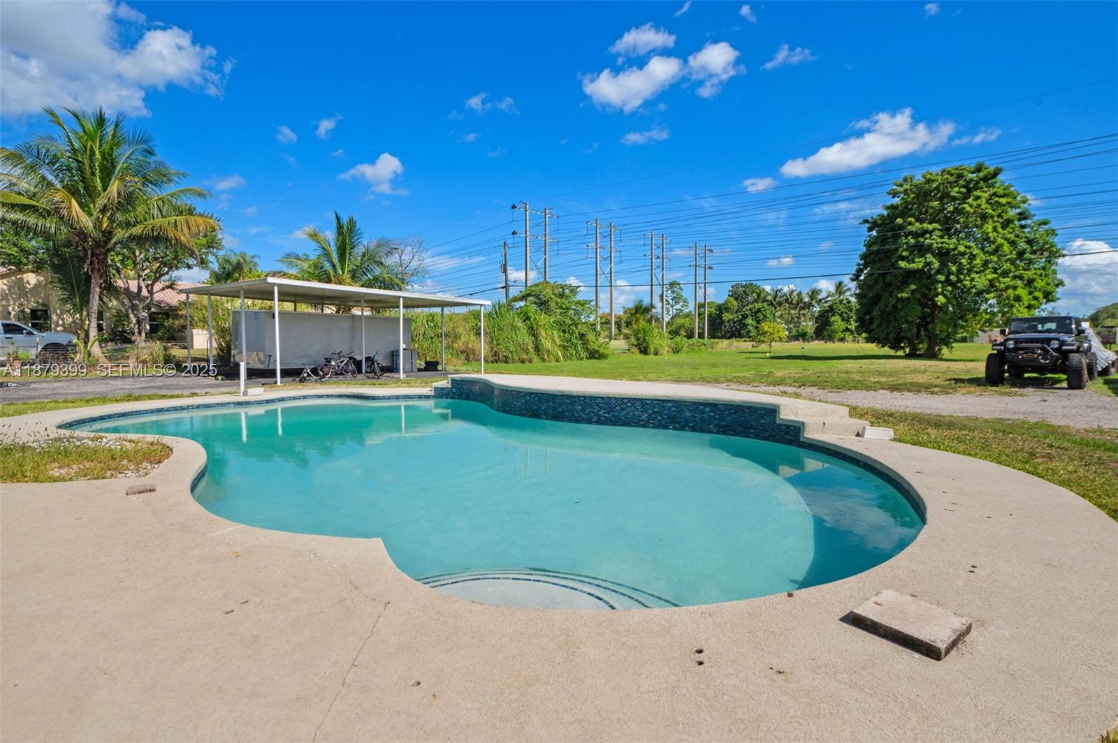 17611 Southwest 66th Street Southwest Ranches, FL 33331 - Photo 26 of 45 a view of a swimming pool with a yard