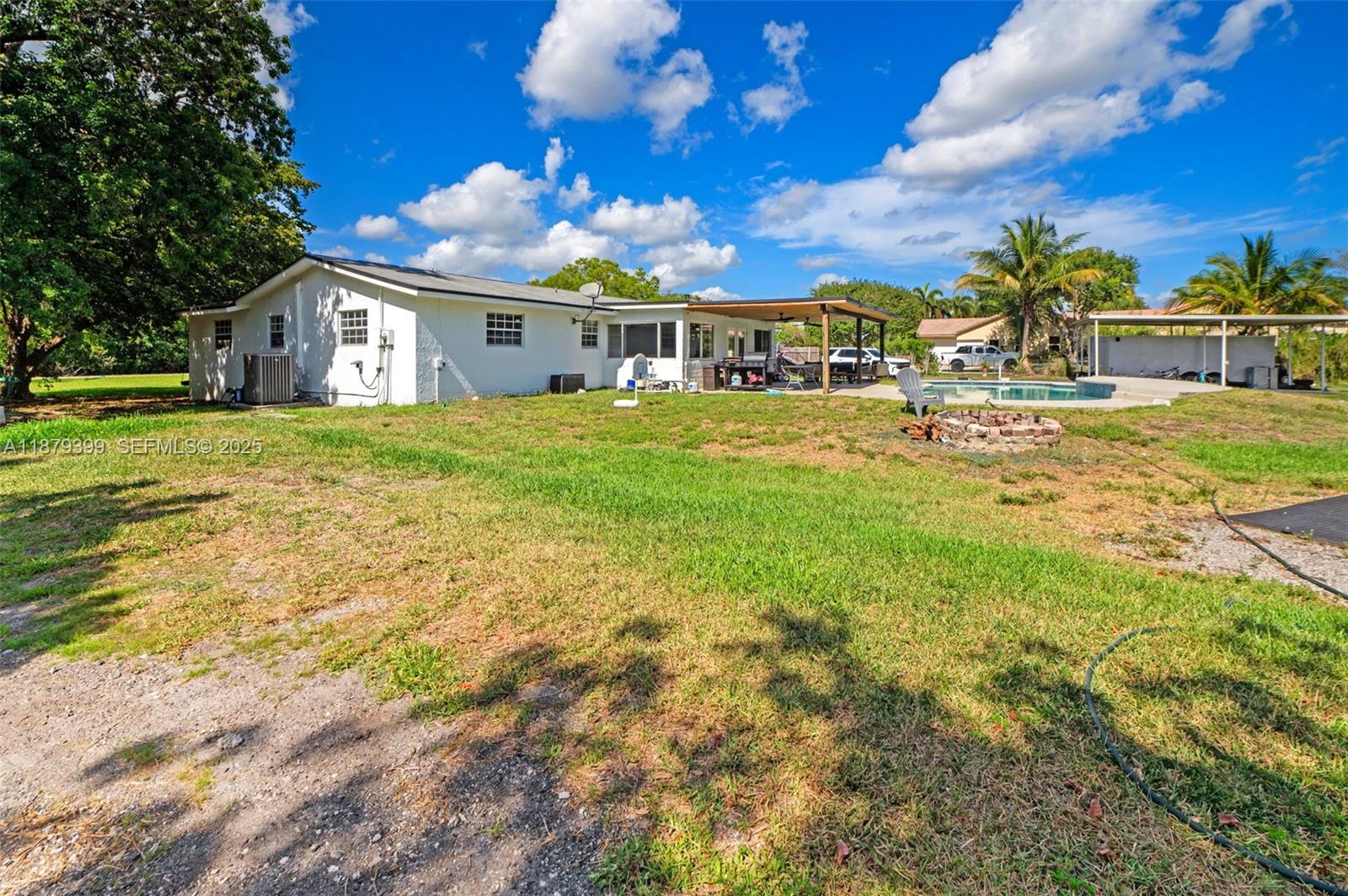 17611 Southwest 66th Street Southwest Ranches, FL 33331 - Photo 31 of 45 a front view of house with yard and seating area