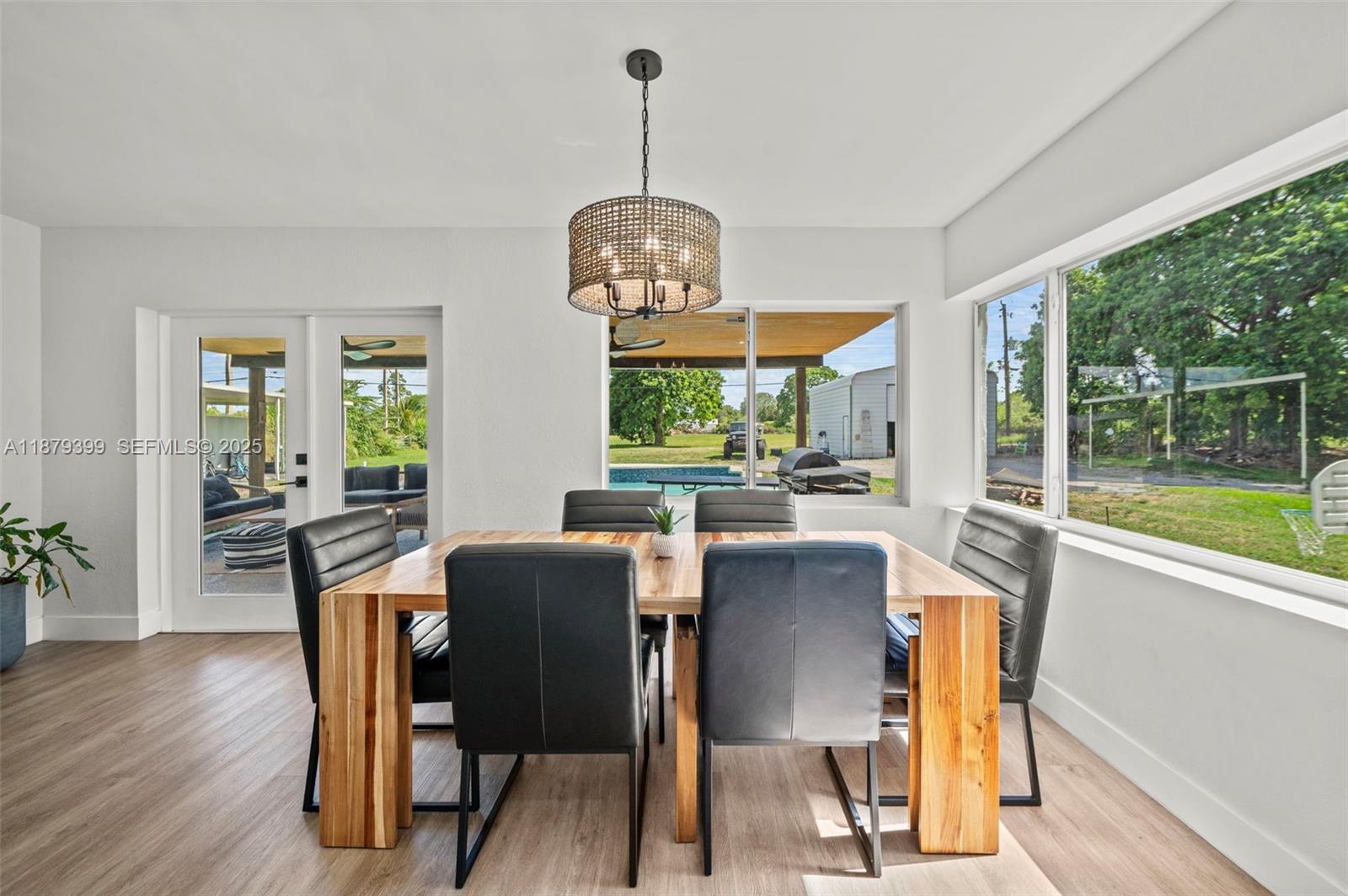17611 Southwest 66th Street Southwest Ranches, FL 33331 - Photo 4 of 45 a view of a dining room with furniture window and wooden floor