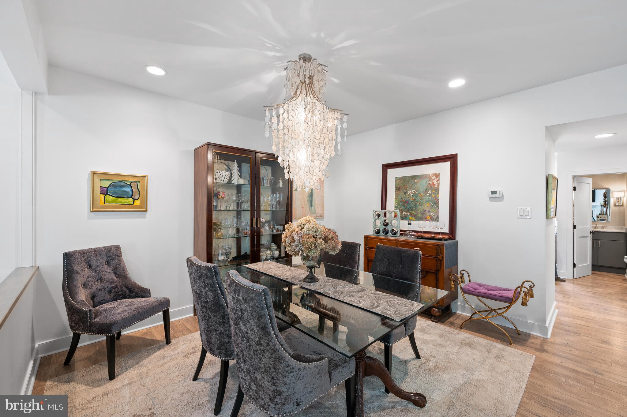 21 Greythorne Woods Circle Wayne, PA 19087 - Photo 8 of 22 a dining room with furniture a chandelier and wooden floor