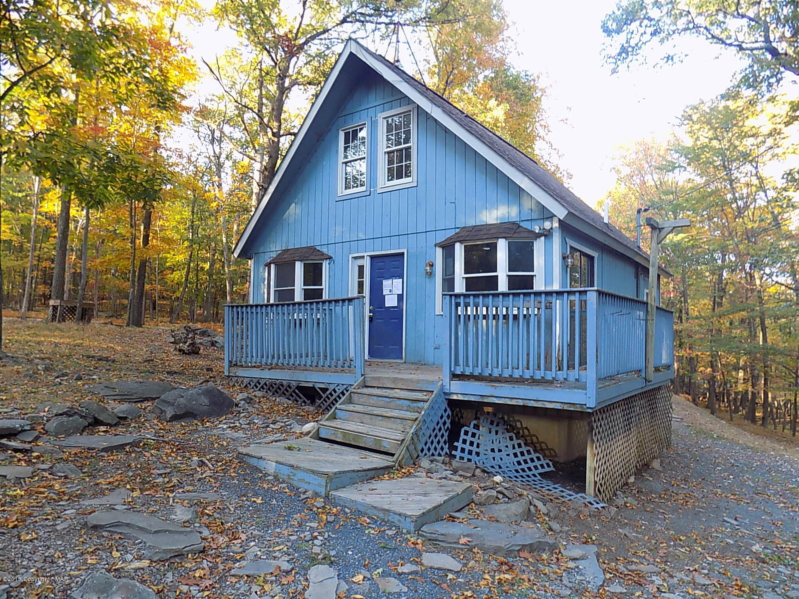 521 Gold Finch Road Bushkill, PA 18324 - Photo 12 of 14 a view of wooden house with a yard and wooden fence