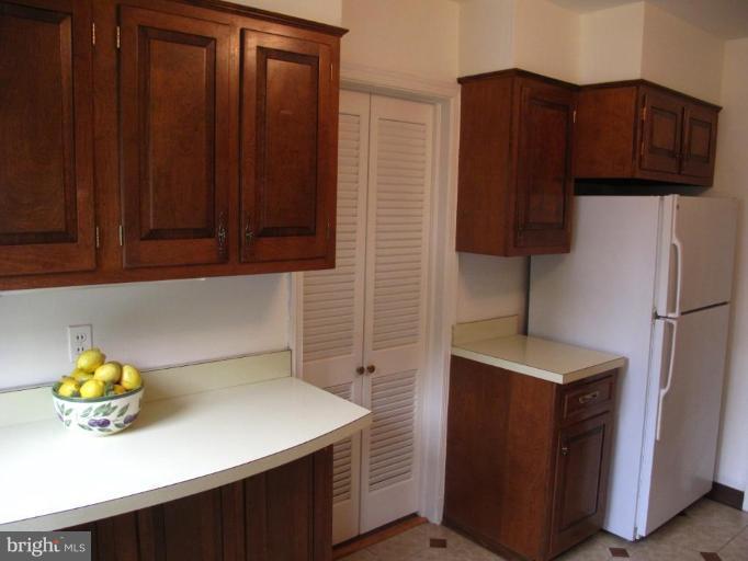 9508 Wire Avenue Silver Spring, MD 20901 - Photo 10 of 10 a kitchen with a sink cabinets and a window