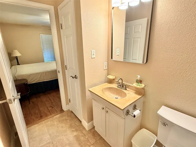 a bathroom with a sink toilet and tub