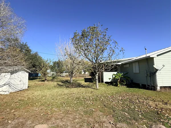 a view of a house with a snow in the yard